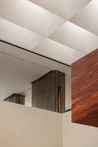 Modern interior design featuring glass reflections and clean lines.