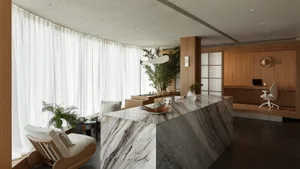 Spacious spa interior featuring modern design with marble elements and natural light.