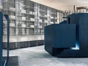 Modern retail storefront with metal shelving and concrete floors