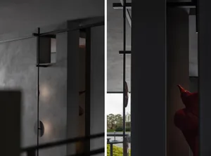 Modern interior design featuring glass panels and architectural columns.