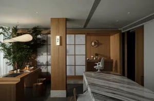 Modern minimalist home office featuring wooden furniture and materials, including a desk, chair, and storage solutions.