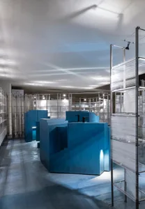 Modern retail space featuring blue retailing counters in a contemporary design.