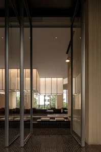A modern spa relaxation room featuring glass walls and recessed lighting