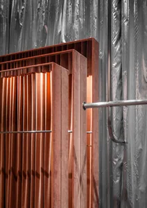 Metal industrial desk with a pipe frame and wooden top.