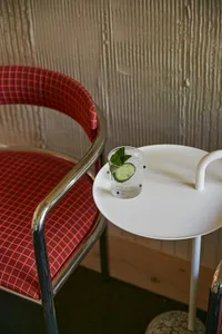 Modern interior of a restaurant featuring a glass cocktail.