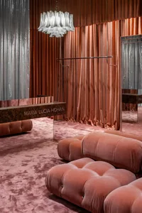 A retro fashion store with velvet and glass decor.