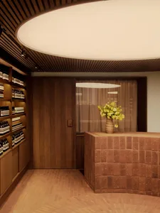 Modern spa reception desk with a vase of flowers and wood accents