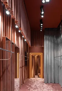 Industrial-style retail shop featuring curtains and LED lighting fixtures