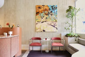 Modern interior designed with minimalist style, featuring concrete and wood elements.