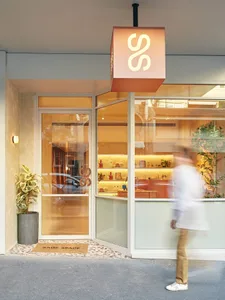 Modern storefront with glass walls and a terrazzo floor