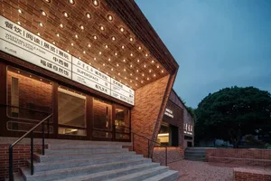 Modern urban architecture featuring brick, concrete, and glass materials
