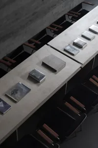 Modern library interior with concrete walls and recessed shelves