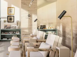 A modern reception area with marble furniture and minimalist design.