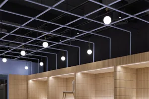 A modern minimalist interior featuring wooden elements and light fixtures.