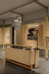 A retail storefront with wooden finishes and a prominent Starter logo.