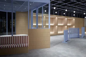 A modern cafe interior with wooden paneling and glass elements, rendered in a digital format.