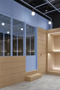Modern conference room with tiled walls and concrete floor