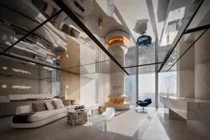 Modern living room featuring marble and glass elements.