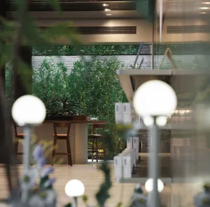 Modern cafeteria with green plants and greenery