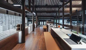A traditional coffee shop with wooden features and a sleek design.