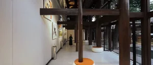 A minimalist corridor with art exhibitions featuring wood material