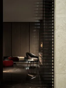 A minimalist living room with marble accents.