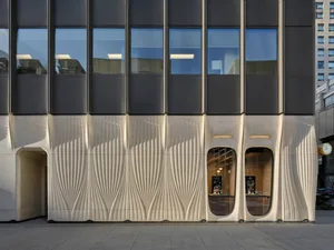 A modern building with a metallic cladding facade.