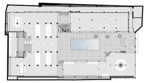 Detailed architectural floor plan of a modern library featuring concrete flooring, glass walls, and a spacious carpeted area.