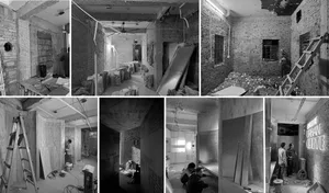 Construction site featuring exposed brick walls during a remodel process.