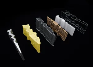 Various design materials including foam, metal, cardboard, and wire.