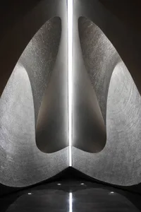 Modern architectural design featuring a column constructed from textured tile.