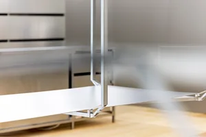 A minimalist office space with metallic surfaces