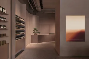 Modern retail shop featuring minimalist design and concrete interior.