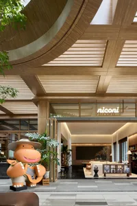 A modern hotel lobby featuring wooden elements.
