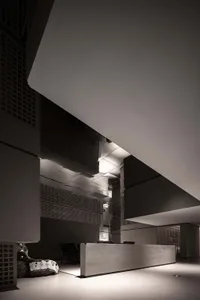 Modern industrial lobby featuring concrete walls and white walls.