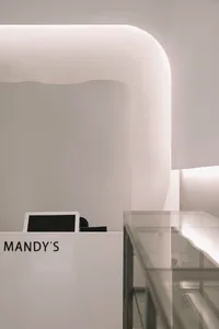 Minimalist office space featuring a sleek glass reception desk