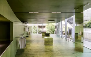 Modern clothing retail store with concrete flooring and minimalist design.