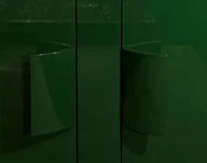 A modern interior design featuring green metal elements.
