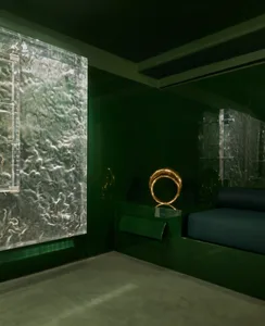 A modern living room featuring glass walls and furniture