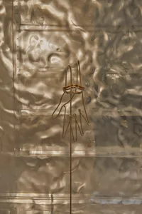 A contemporary metal sculpture with an abstract design.