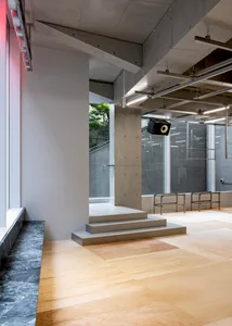 A minimalist interior design with concrete materials and a modern aesthetic.