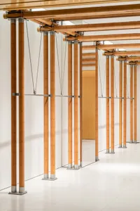An image of a modern commercial interior showcasing wooden columns.
