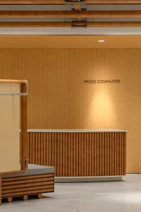 A modern reception desk with a wood paneling design.