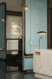 Modern bathroom featuring marble and glass elements
