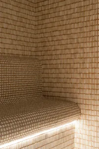 Modern bathroom with tiled shower and illuminated lighting