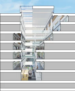 A modern office building interior with glass walls and concrete floors.