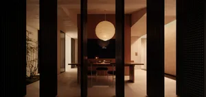 A modern dining room featuring wooden surfaces and lighting