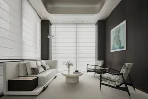 Modern minimalist living room with white sofa, floral chairs, and abstract painting.