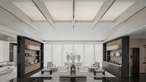 Contemporary office lounge featuring minimalist design with sleek, white furnishings on a polished black floor.