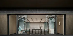 Modern storefront with large glass windows and sleek, contemporary design.